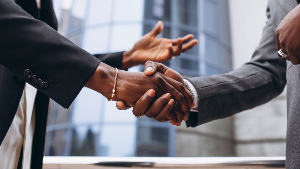 Two businessmen shaking hands.